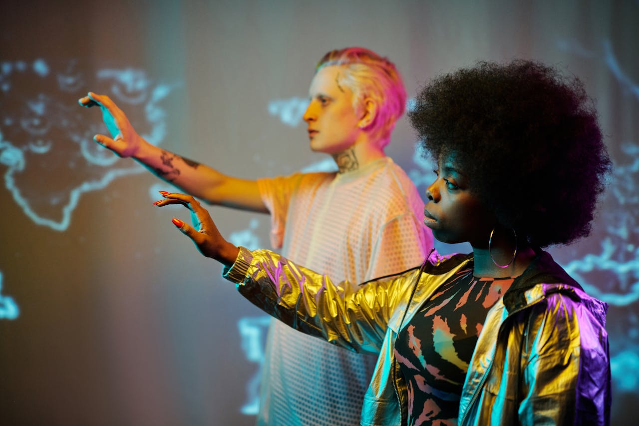 Two adults interacting with virtual screens in futuristic setting.